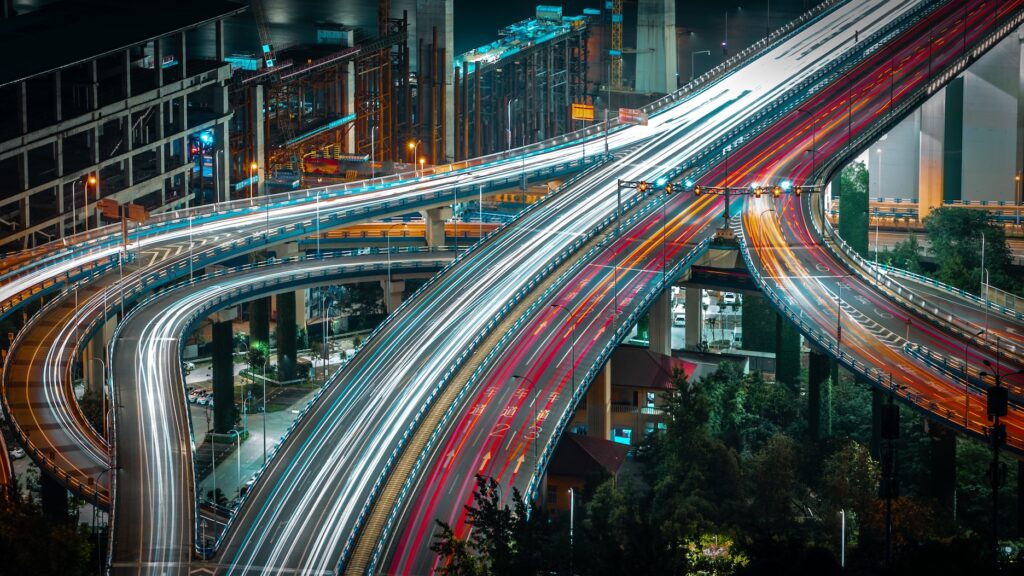 A nightime view of a large fgreeway exchange 