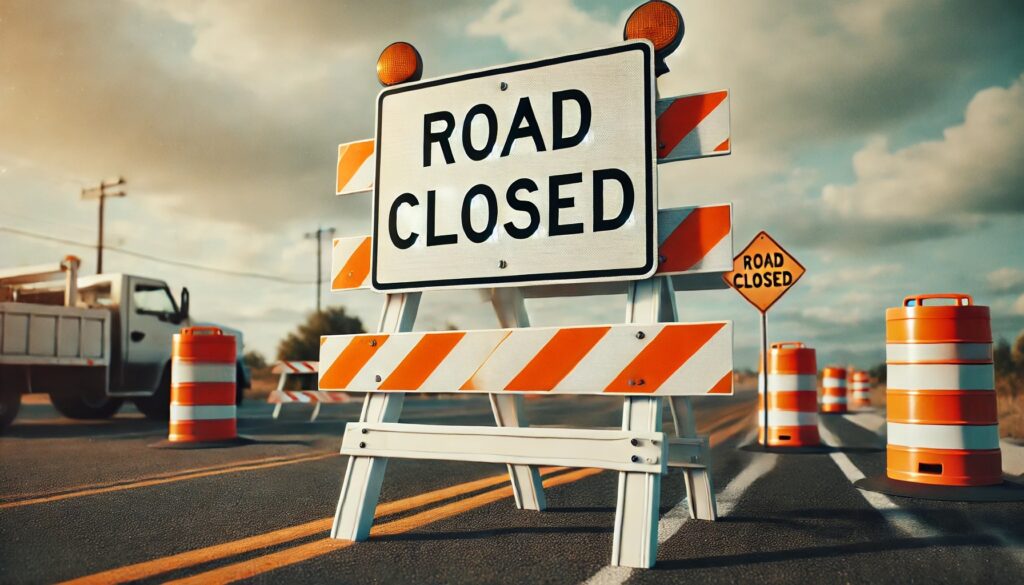 A series of barricades on a closed road  