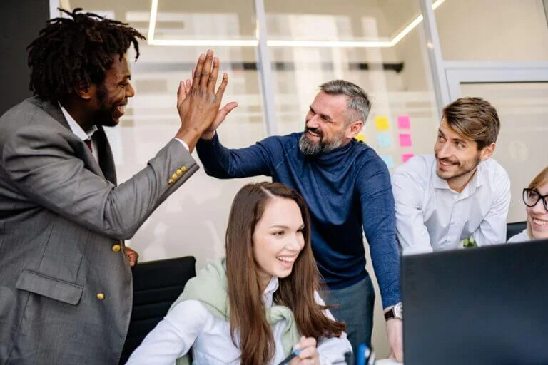 multi-racial business team celebrating success